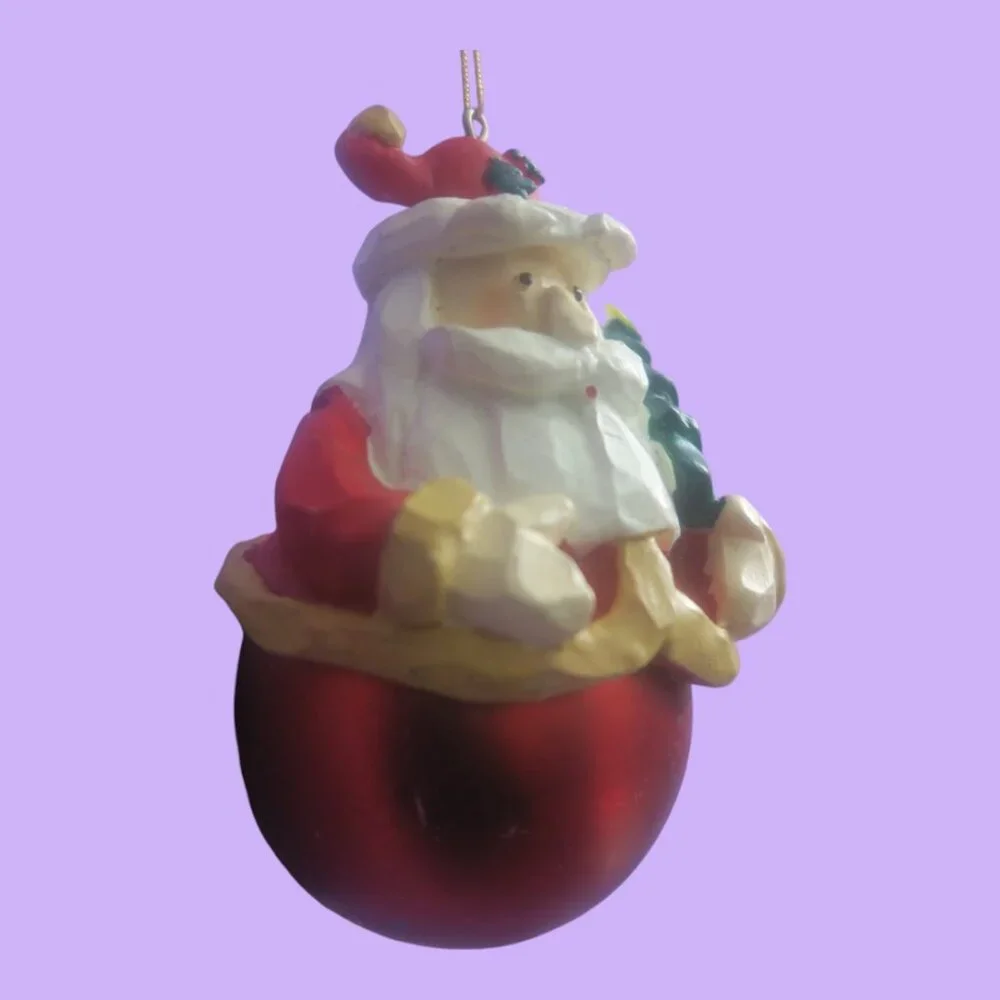 Round ball ornament bottom Santa with tree on hat and in hand in red and white